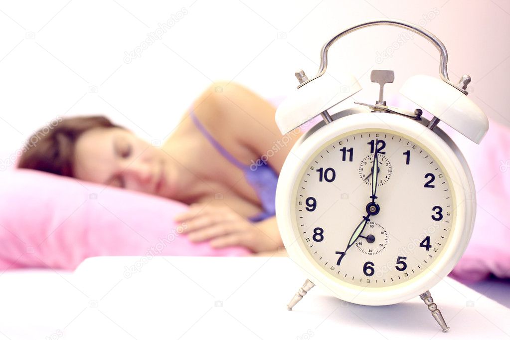 Women and alarm clock — Stock Photo © overcrew 14129519