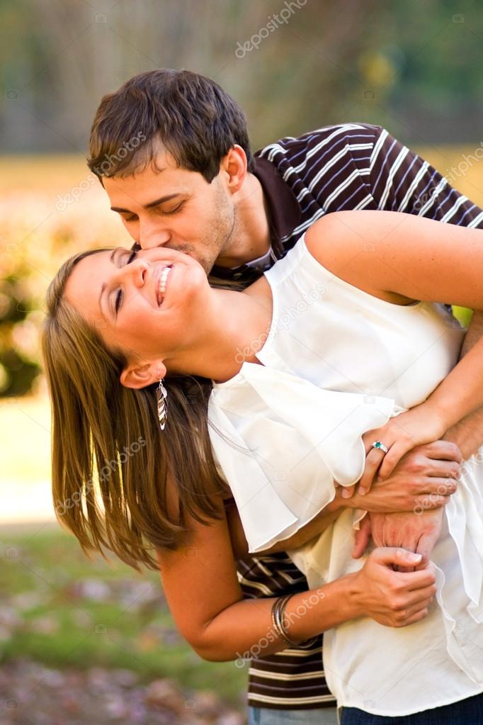 Lovestruck Couple Playfully Embrace