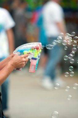 Bubble Guns Blow Bubbles At County Fair clipart