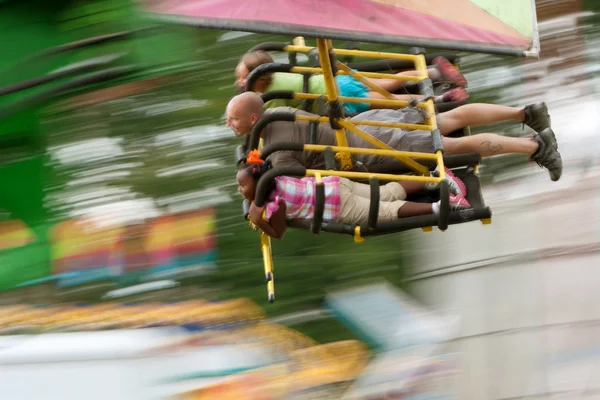 Motion Blur Of On Speedy Carnival Ride — Stock Photo, Image