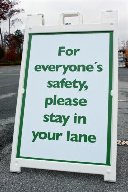 Event Sign Tells People To Stay In Their Lane clipart