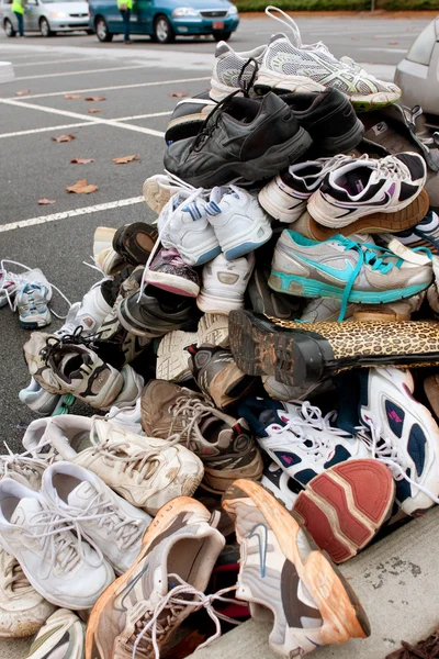 Tennis Shoes Sit Piled High To Be Recycled