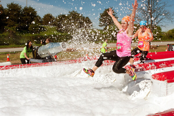 Women Get Sprayed With Bubbles Jumping Into Foam Pit