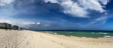 FORT LAUDERDALE, FL / USA - OCTOBER 5: Panorama shows beach, ocean and blue sky along  coastline on October 5, 2020 in Fort Lauderdale, FL.