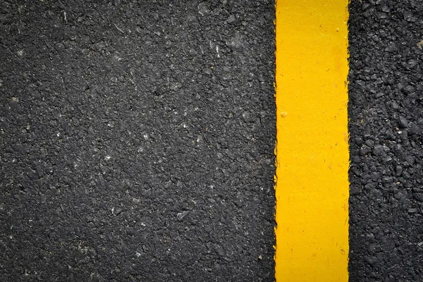 New yellow line on the road texture — Stock Photo, Image