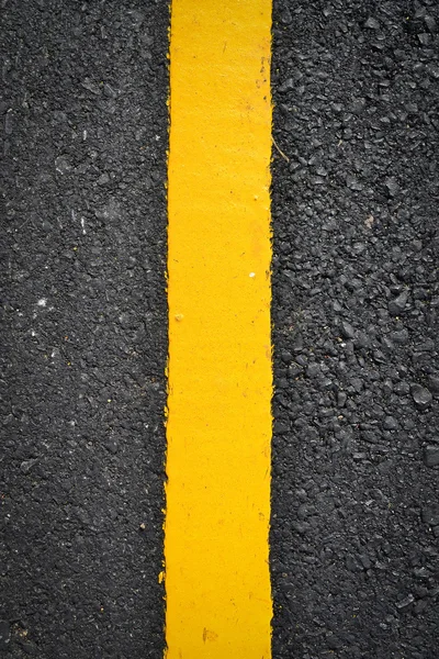 Nová žlutá čára na silnici textury — Stock fotografie