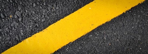 New yellow line on the road texture — Stock Photo, Image