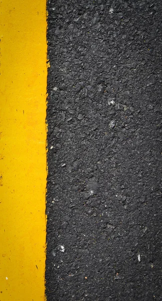 New yellow line on the road texture — Stock Photo, Image