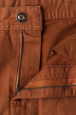 Kahverengi kotun üzerinde açık fermuar. Yakın plan..