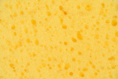 Yellow washing sponges texture. Close-up.