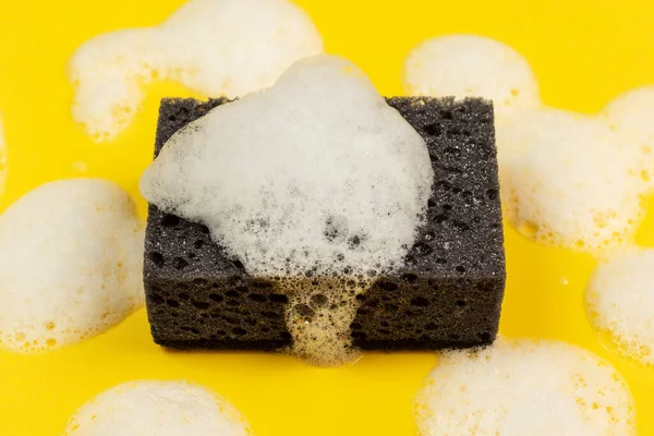 Black Cleaning Sponge Foam Yellow Background —  Fotos de Stock