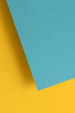Paper background with yellow and blue colors.