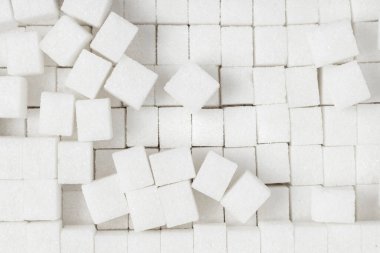 White sugar cubes background. Top view.