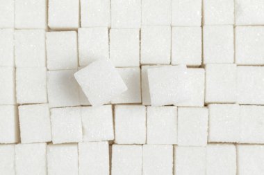White sugar cubes background. Top view.