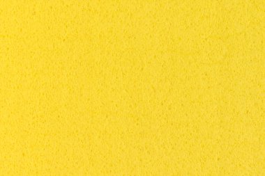 Yellow washing rag background. Close-up, full frame photo.