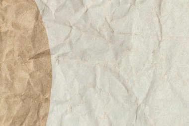 Crumpled brown beige paper. Texture background.