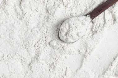 Organic white wheat flour. Top view, close-up.