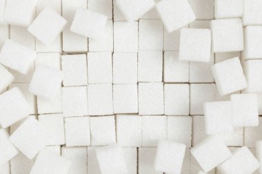 White sugar cubes background. Top view.