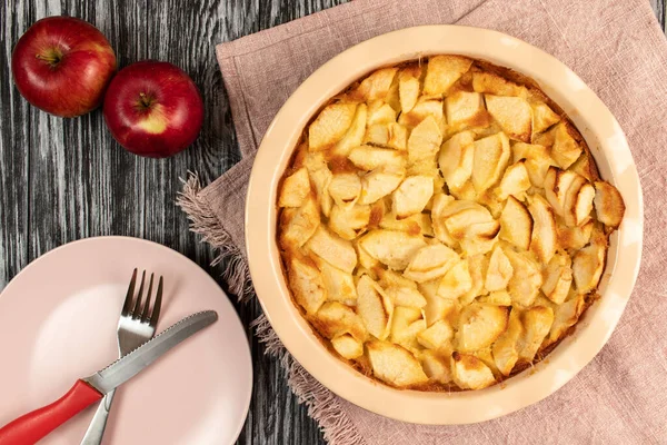 Freshly baked clafoutis pie with apples. Apple pie. Top view.