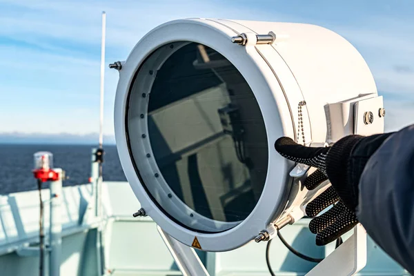 The signal lamp is designed to provide Morse code light signals and lighting. Visual communication with ships and coastal posts. Stock Photo