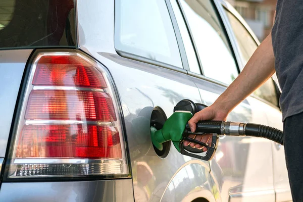 Pumping gasoline fuel in car at gas station.concept Travel and transportation. — Stock Fotó