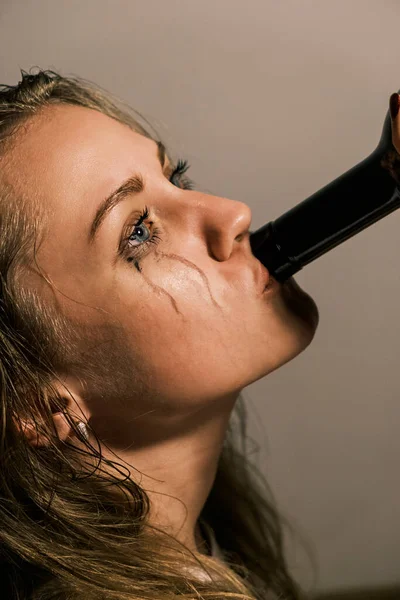 Crying Young Woman Smeared Mascara Drinks Alcohol Neck Bottle Side — Fotografia de Stock