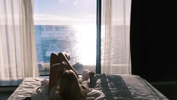 Woman Transparent Bathrobe Dances Backdrop Panaramic Window Overlooking Sea Sunny — Stock Video