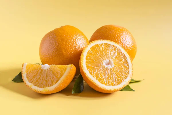 Bright Juicy Oranges Green Leaves Orange Background Close — Stockfoto