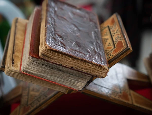 Old books in a flea market for sale, selective focus.