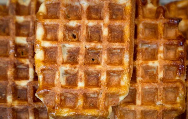 Homemade Belgian waffles with honey background