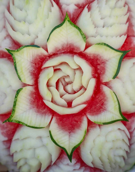 Juicy carving water melon turns into a very beautiful flowers. Art of fruits and vegetable carving. The art of Thailand.