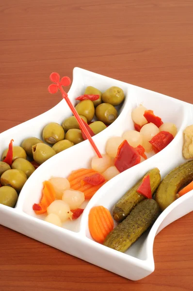 Cup with mixed pickles as appetizer