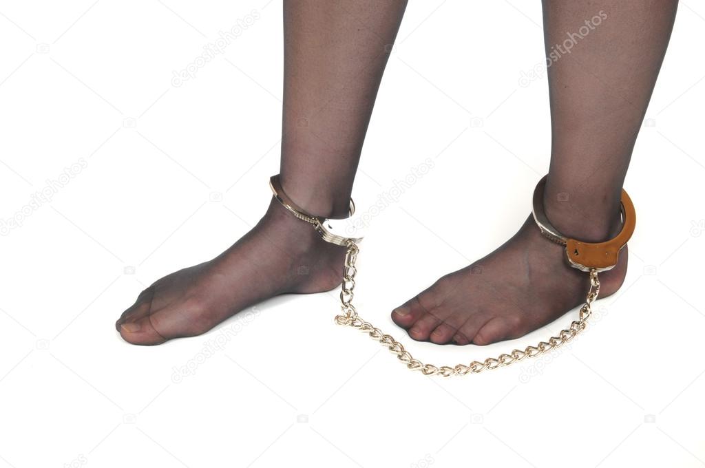 Legs of a young woman in shackles — Stock Photo © pejo 13135901