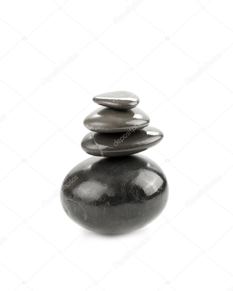 Balanced Zen stones on white background