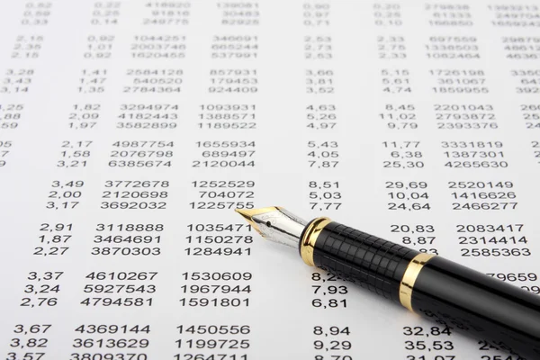 Financial report and pen — Stock Photo, Image