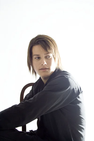 Handsome Young Model sitting in Studio — Stock Photo, Image