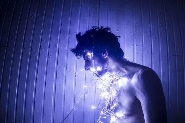 Modelo atractivo en topless con luces led —  Fotos de Stock