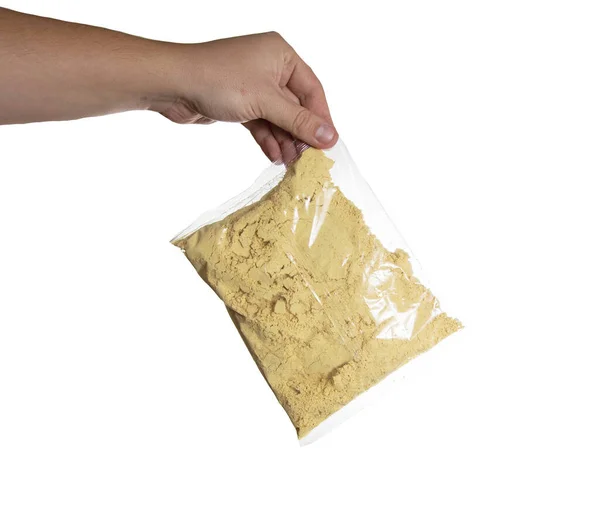 Mustard Powder Sachet Man Hand White Background Isolate Close — Stock Photo, Image