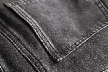 Cep arka planı olan siyah kot pantolon, makro.