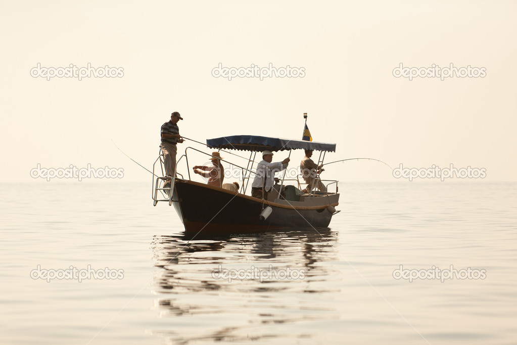 Men go fishing from a boat