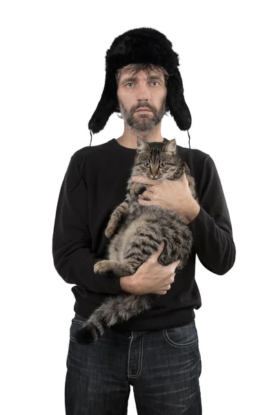 Man in hat ear flaps holding cat — Stock Photo, Image