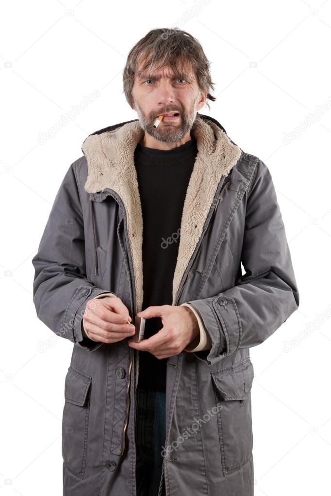 Adult man lights cigarette