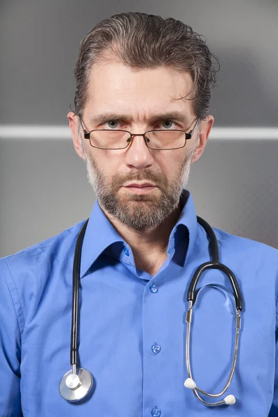 Serious doctor with a stethoscope — Stock Photo, Image