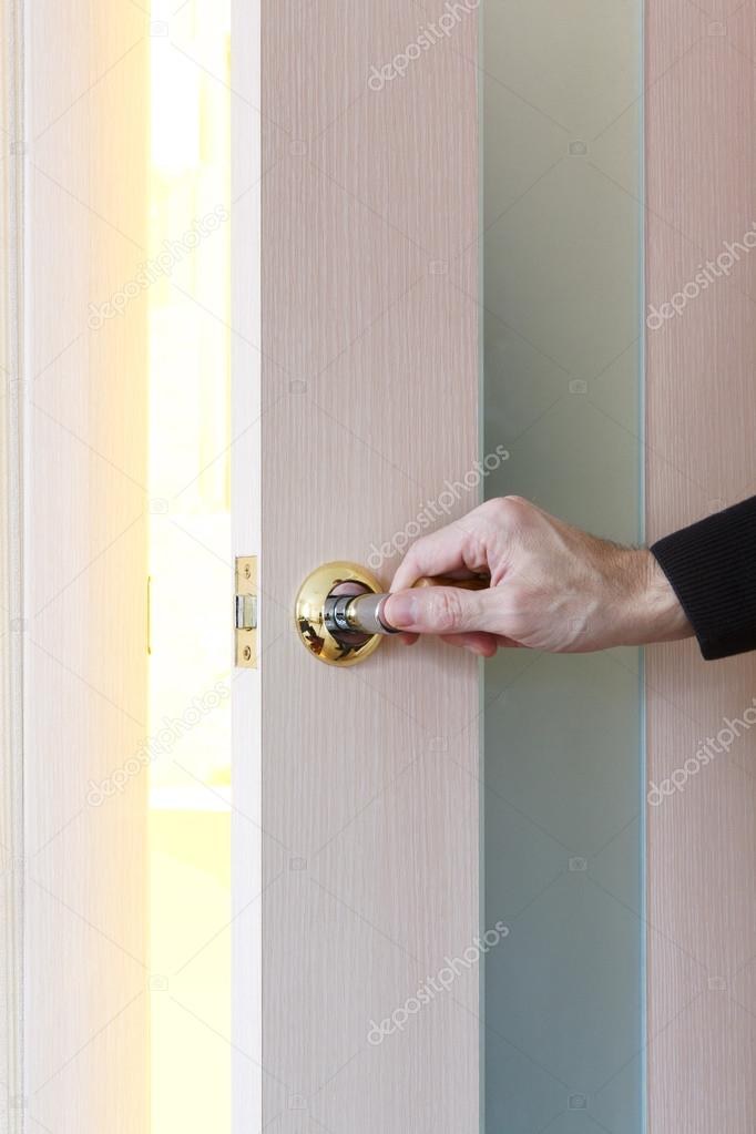 man hand opening door