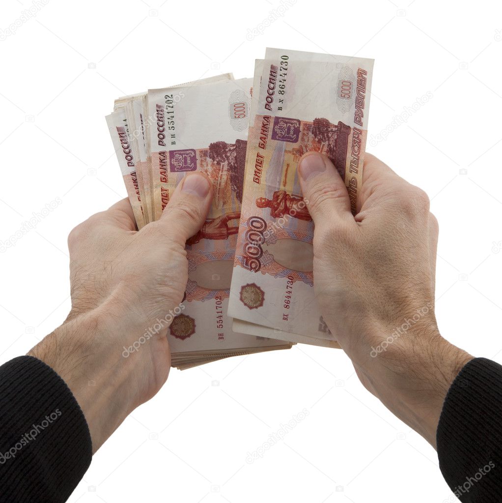 man's hands recalculates cash in Russian rubles
