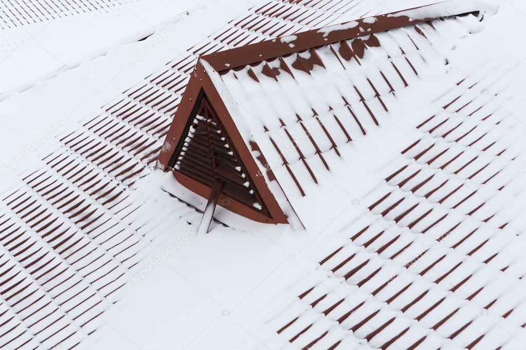 snow on metal tiles roofing