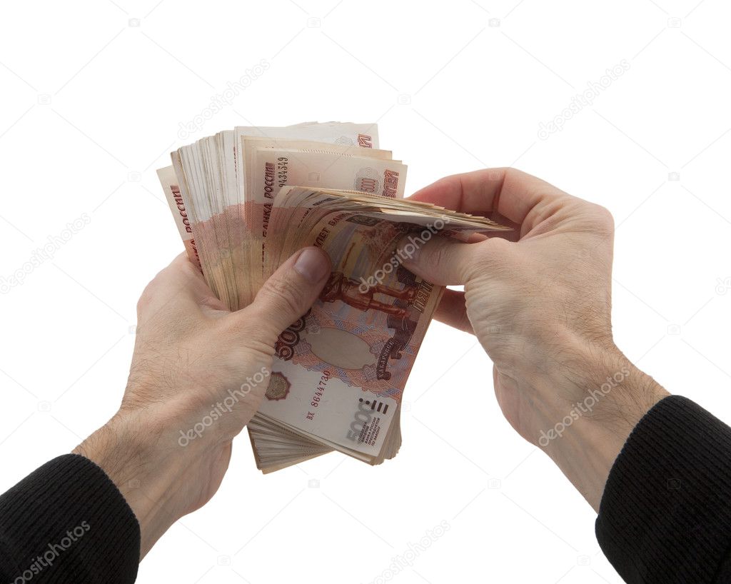 man's hands recalculates cash in Russian rubles