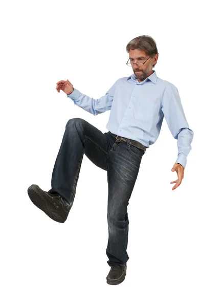 Adult man kicking something isolated — Stock Photo, Image