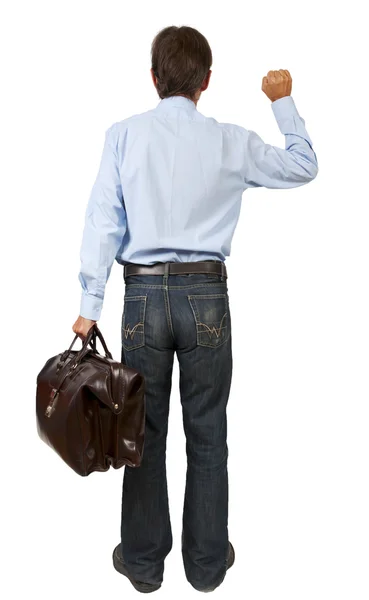 Man with a suitcase knocking on imaginary door — Stock Photo, Image