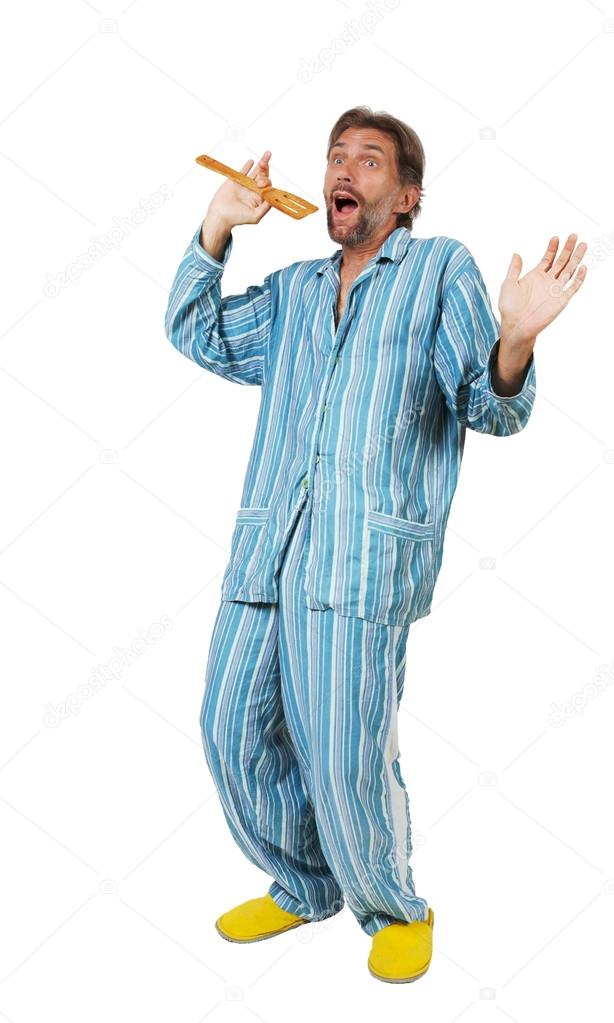 man in pajamas singing